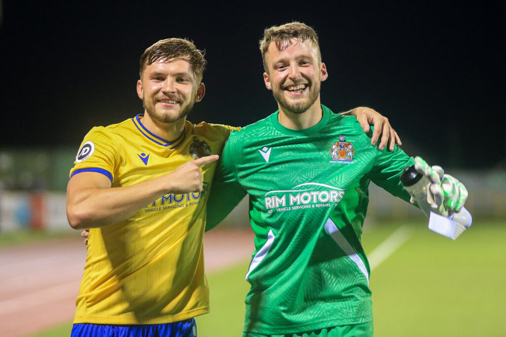 Barry Town players Evan Press and Liam Armstrong celebrate against Llanelli Town