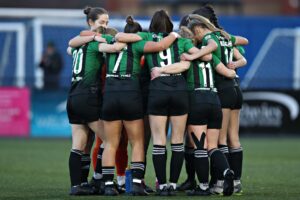 Aberystwyth Town players in a huddle prior to their game against TNS.