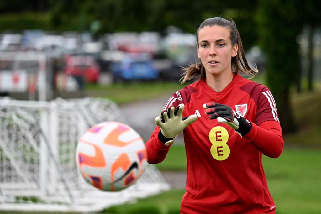 Wales goalkeeper Olivia Clark prepares to catch a ball during a training session. 