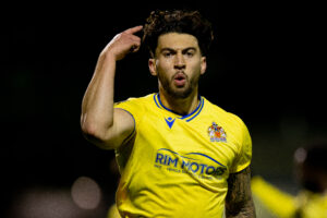 Barry Town's Ollie Hulbert celebrates scoring against Aberystwyth Town.