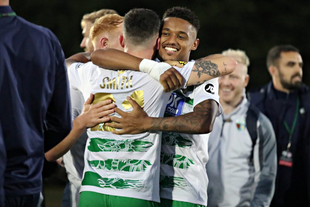 Adam Wilson celebrates with TNS teammate Leo Smith