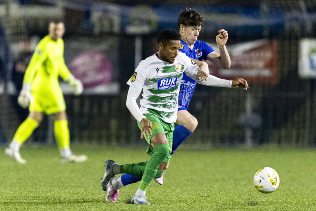 Kenya's Adam Wilson in action for TNS against Penybont