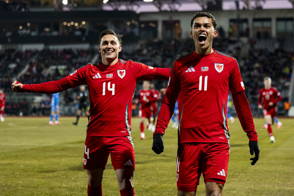 Connor Roberts celebrates with Brennan Johnson after scoring Wales first goal against Iceland