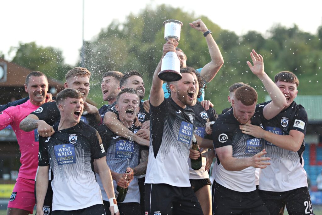 Haverfordwest celebrate winning the penalty shoot-out after  Newtown AFC vs Haverfordwest County AFC in the JD Cymru Premier European Play-Off final at Latham Park, Newtown