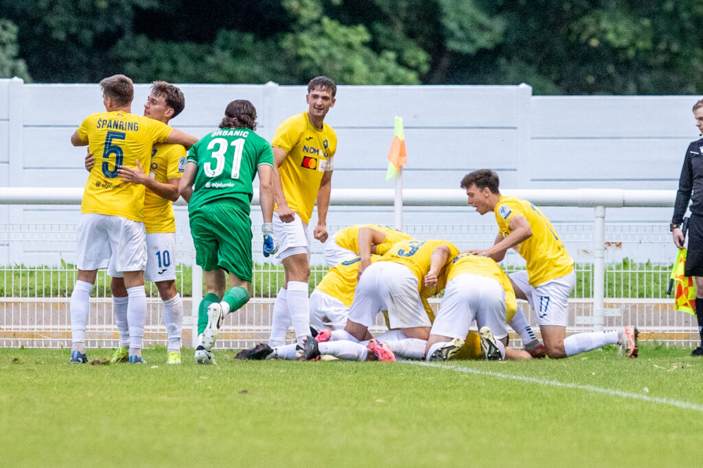 BANGOR, WALES - 18 APRIL 2024: NK Bravo players celebrate their late goal during Connah’s Quay Nomads vs NK Bravo in the UEFA Conference League First Qualifying Round Second Leg fixture at Nantporth Stadium, Bangor, Wales