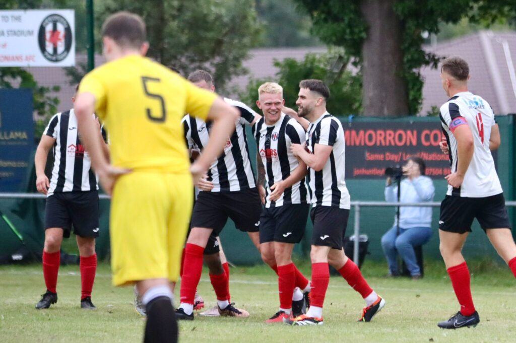 Cardiff Dracs celebrate scoring a goal against AFC Llwydcoed in the Ardal South West