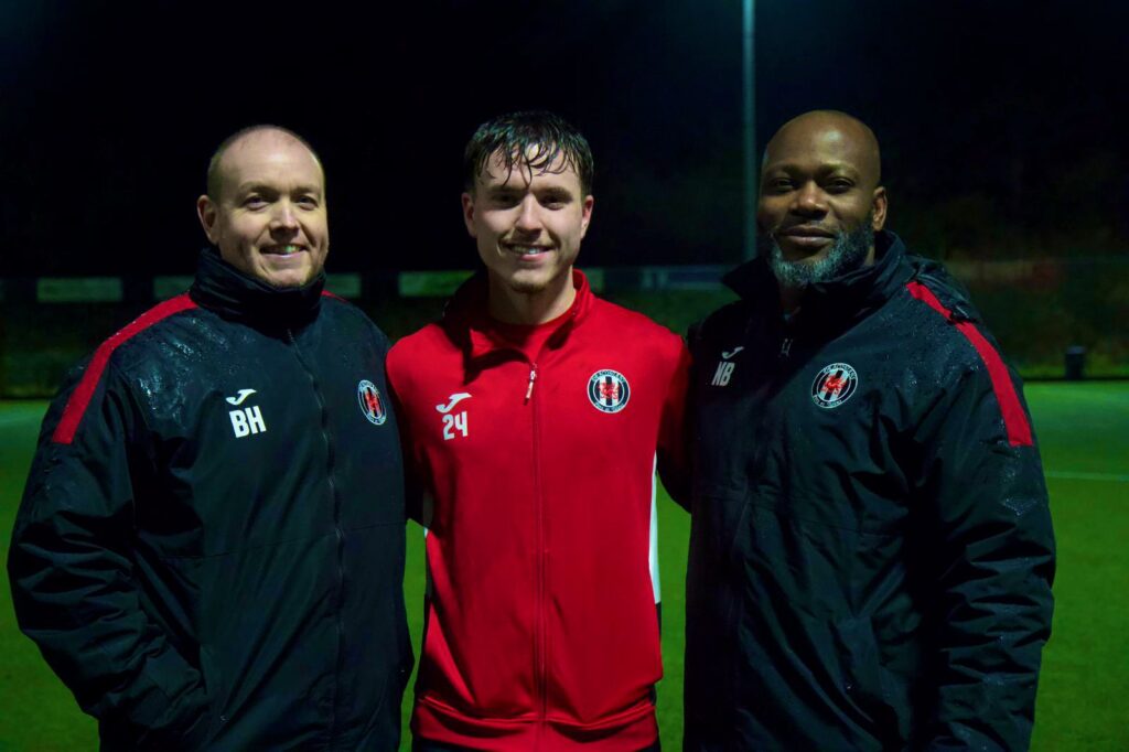 Cardiff Dracs assistant coach Ben Hartrey, player Luke Davies and Nana Baah pose for the camera