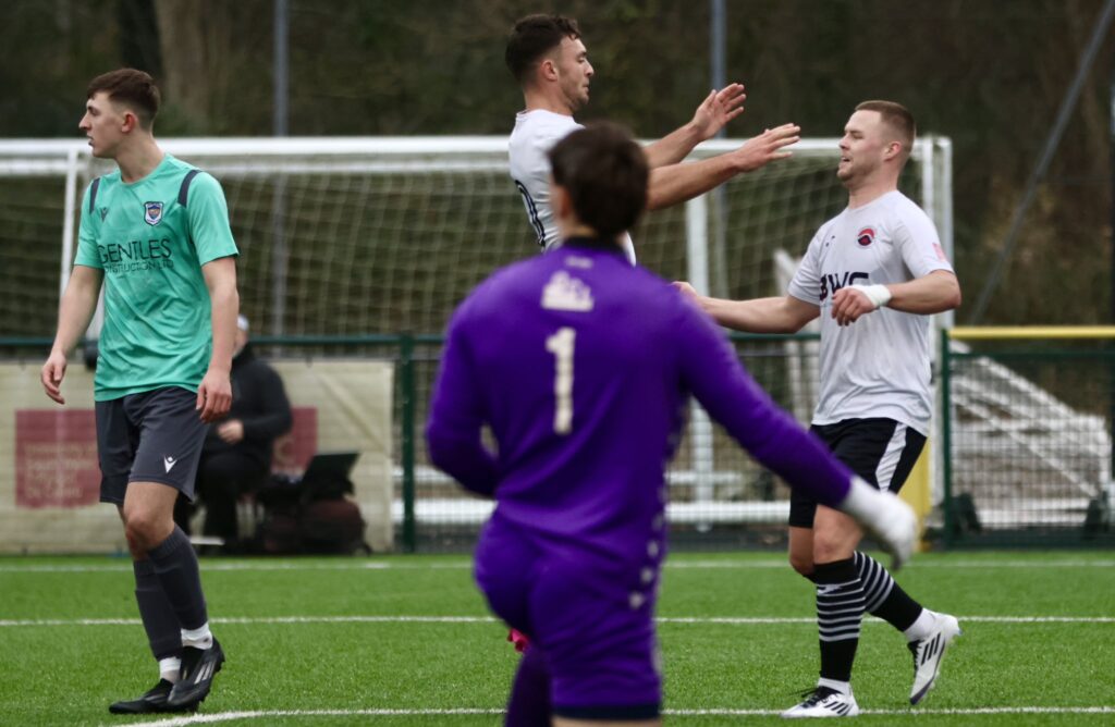 Liam Eason celebrtates with Dan Griffiths after scoring Pontypridd's second goal against Taffs Well in the Cymru South.