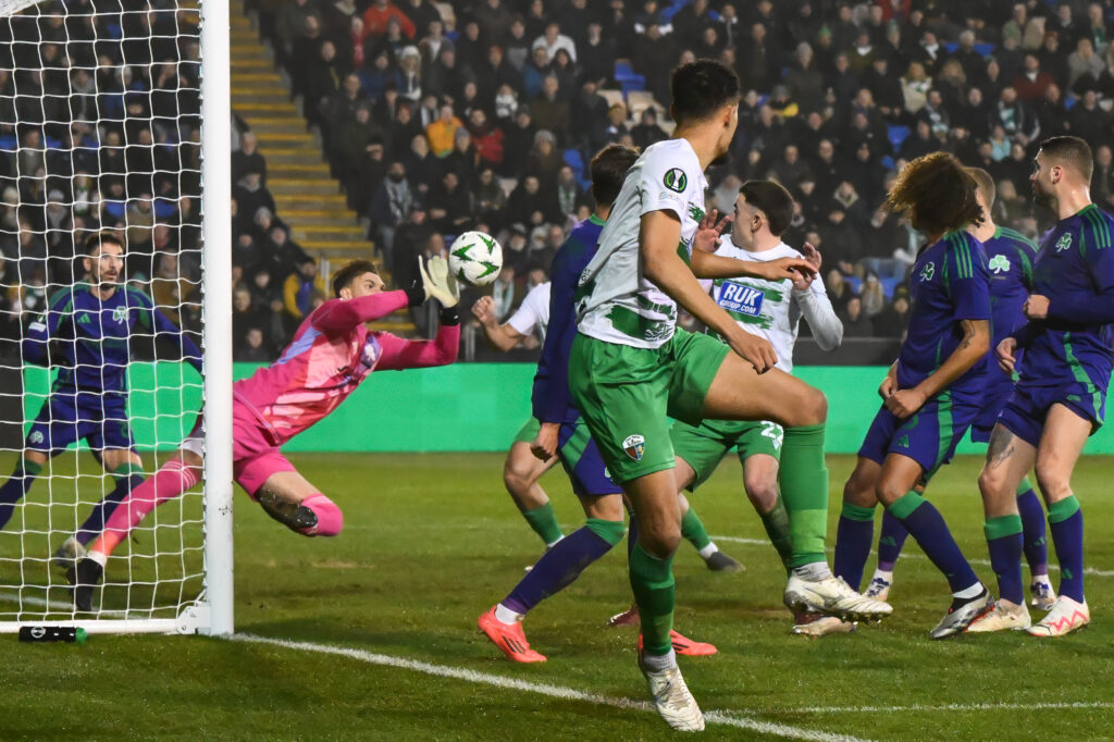 Bartłomiej Drągowski of Panathinaikos saves from the header of Josh Pask of The New Saints F.C. during the UEFA Conference League - League Stage The New Saints v Panathinaikos at Croud Meadow, Shrewsbury, United Kingdom, 12th December 2024
