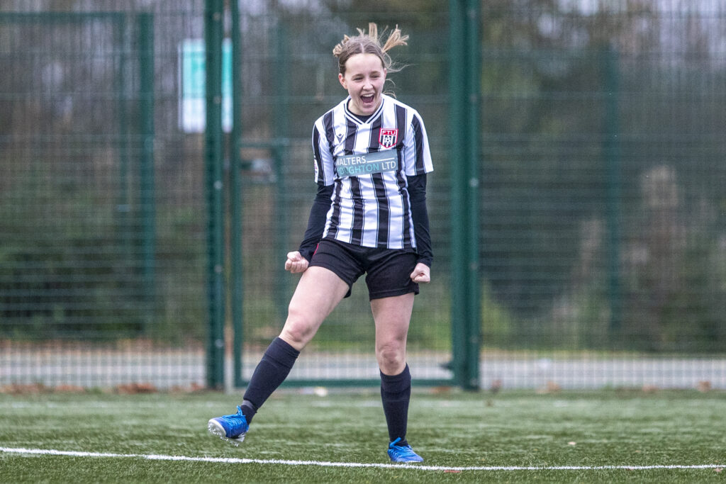 Flint Town United Ladies' Rosie Hughes makes it 2-2 during the Genero Adran North fixture between Connah's Quay Nomads Women and Flint Town United Ladies at The Poppies 3G