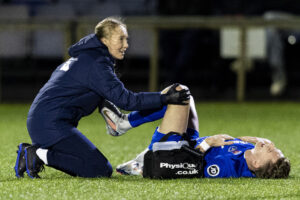 Nathan Wood of Penybont receives treatment. Penybont v Cardiff Metropolitan University in the JD Cymru Premier at the SDM Glass Stadium on the 31st December 2024