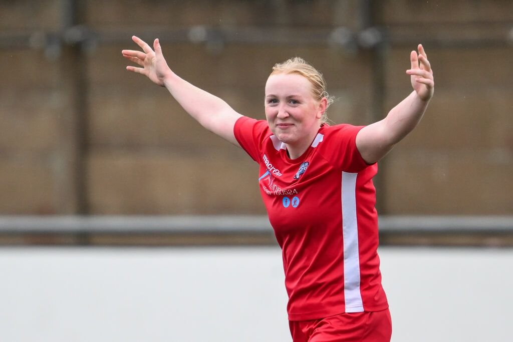 Llanfair United Womens' Harriet Davies celebrates her goal to make it 1-4 during the 2024/25 Genero Adran North fixture between Flint Town United Women v Llanfair United Women at Essity Stadium, Flint, Wales
