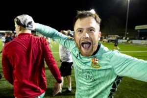 Llanelli Town goalkeeper Scott Coughlan celebrates at full time. Cambrian United v Llanelli Town in the JD Cymru South at the M&P Group 3G on the 4th April 2025