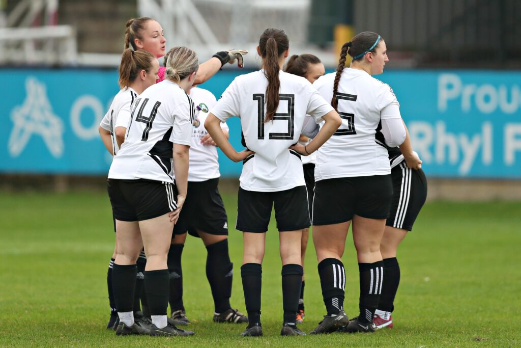Rhyl huddle before CPD Y Rhyl 1879 Women vs Flint Town United Ladies in Round 2 of the Genero Adran Trophy Group 2 at Belle Vue, Rhyl