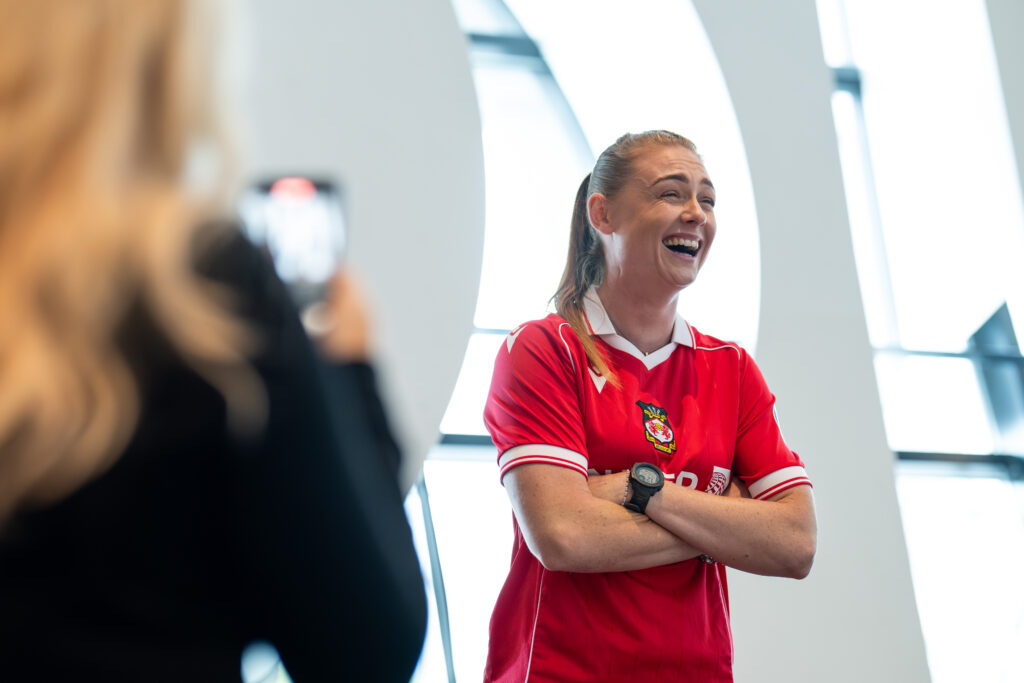 Wrexham AFC's Jodie Bartle laughs during a media session on the Genero Adran Premier launch day