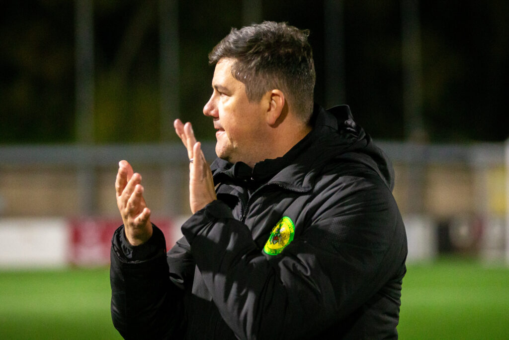 Caernarfon Town's Manager, Richard Davies celebrates at full time following the JD Cymru Premier fixture between Connah’s Quay Nomads and Caernarfon Town at the Essity Stadium, Flint, 23rd of September, Wales