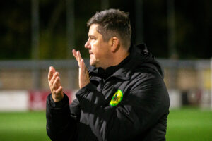 Caernarfon Town's Manager, Richard Davies celebrates at full time following the JD Cymru Premier fixture between Connah’s Quay Nomads and Caernarfon Town at the Essity Stadium, Flint, 23rd of September, Wales