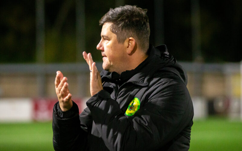 Caernarfon Town's Manager, Richard Davies celebrates at full time following the JD Cymru Premier fixture between Connah’s Quay Nomads and Caernarfon Town at the Essity Stadium, Flint, 23rd of September, Wales