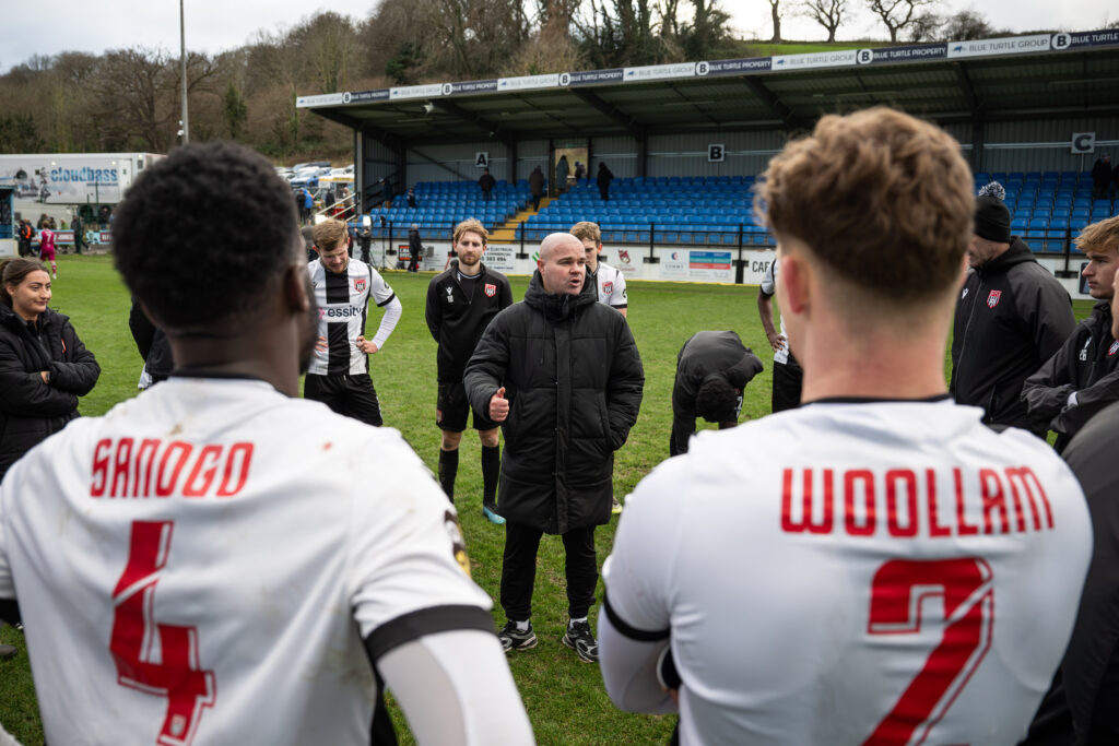 COLWYN BAY, WALES - 01 January 2026: Lee Fowler Manager of Flint Town give his sides post game talking in the team huddle during the JD Cymru Premier between Colwyn Bay and Flint Town United at the The Blue Turtle Arena in Colwyn Bay