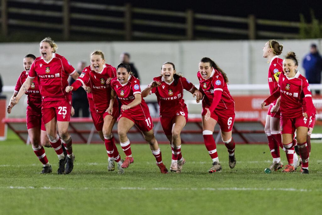 BANGOR, WALES - 22 FEBRUARY 2026: Wrexham celebrate winning the 2025/2026 Genero Adran Trophy final between Wrexham AFC Women & Cardiff City Women FC at Bangor City Stadium, Bangor, Wales