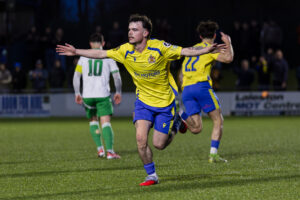 BRIDGEND, WALES - 28 FEBRUARY 2026: Barry Town's Ieuan Owen scores and celebrates 0-1 during the 2025/26 Nathaniel MG Cup Final fixture between The New Saints FC & Barry Town United AFC at the Dragonbet Stadium, Bridgend, Wales