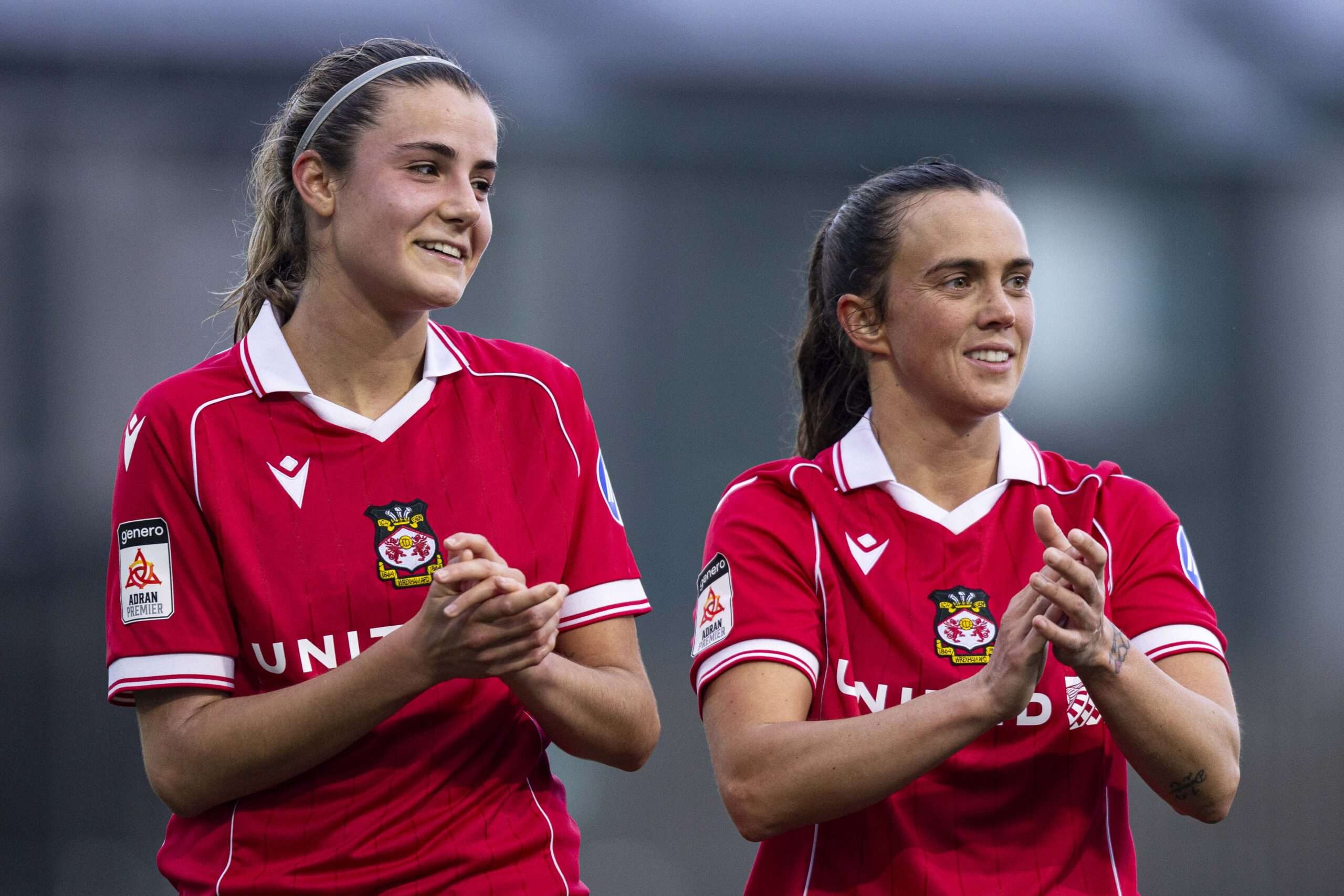 CARMARTHEN, WALES - 8TH FEBRUARY 2026: Ava Suckley & Rosie Hughes of Wrexham at full time. Carmarthen Town v Wrexham in the Bute Energy Welsh Cup at Richmond Park on the 8th February 2026.