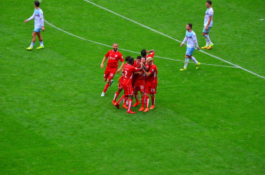 Mark Little celebrates with his Bristol City teammates after a Lee Tomlin goal