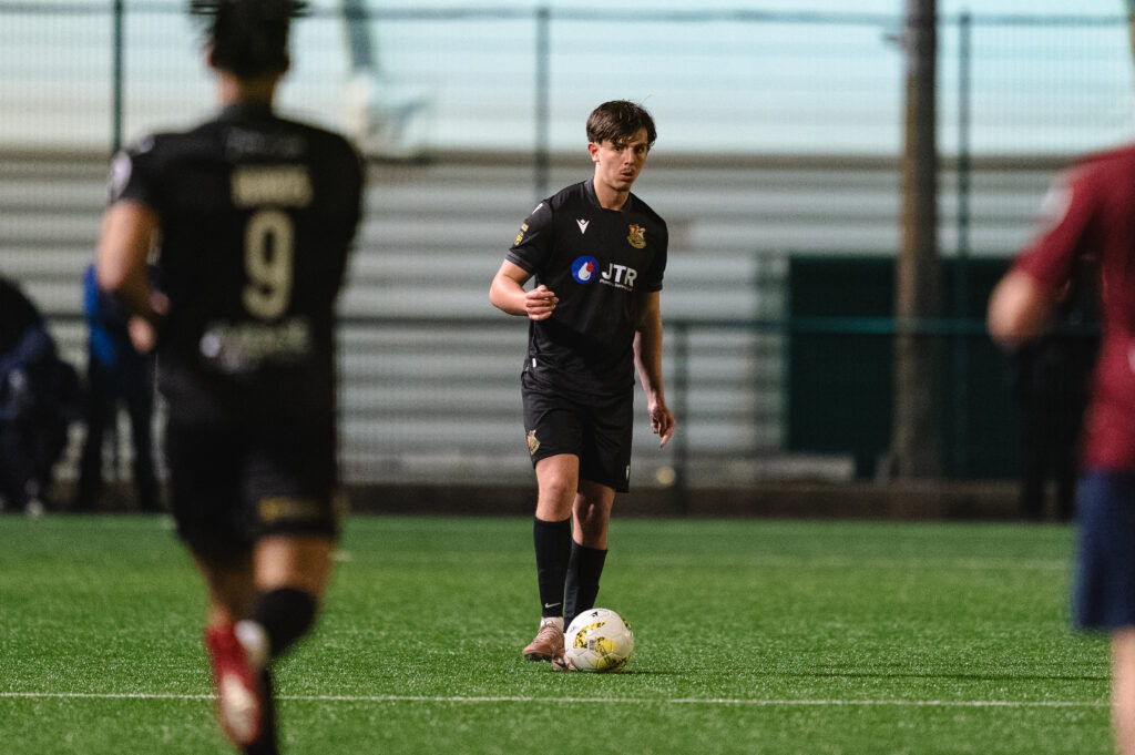 CARDIFF, WALES  - 13 FEBRUARY 2026:James Lester of Llanelli Town and Trinidad & Tobago during the JD Cymru Premier 2025/26 - Play-Off Conference  fixture between Cardiff Met vs Llanelli Town at Cyncoed Stadium, Cardiff, Wales