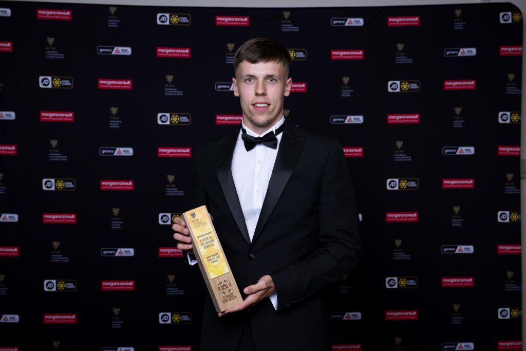 CARDIFF, WALES - 07 JUNE 2025: Former Everton midfielder Rhys Hughes is awarded JD Cymru Premier Player of the Season during the 2025 FAW National League Awards at Holland House Hotel Cardiff By Sunday, Cardiff, Wales
