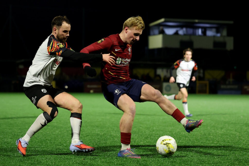 CARDIFF, WALES - 30 DECEMBER 2025: Lewis Rees of Cardiff Met under pressure from Dylan Rees of Haverfordwest County during the JD Cymru Premier 25/26 Phase 1 match between Cardiff Met and Haverfordwest County at Cyncoed Campus in Cardiff on the 30th Decemeber 2025
