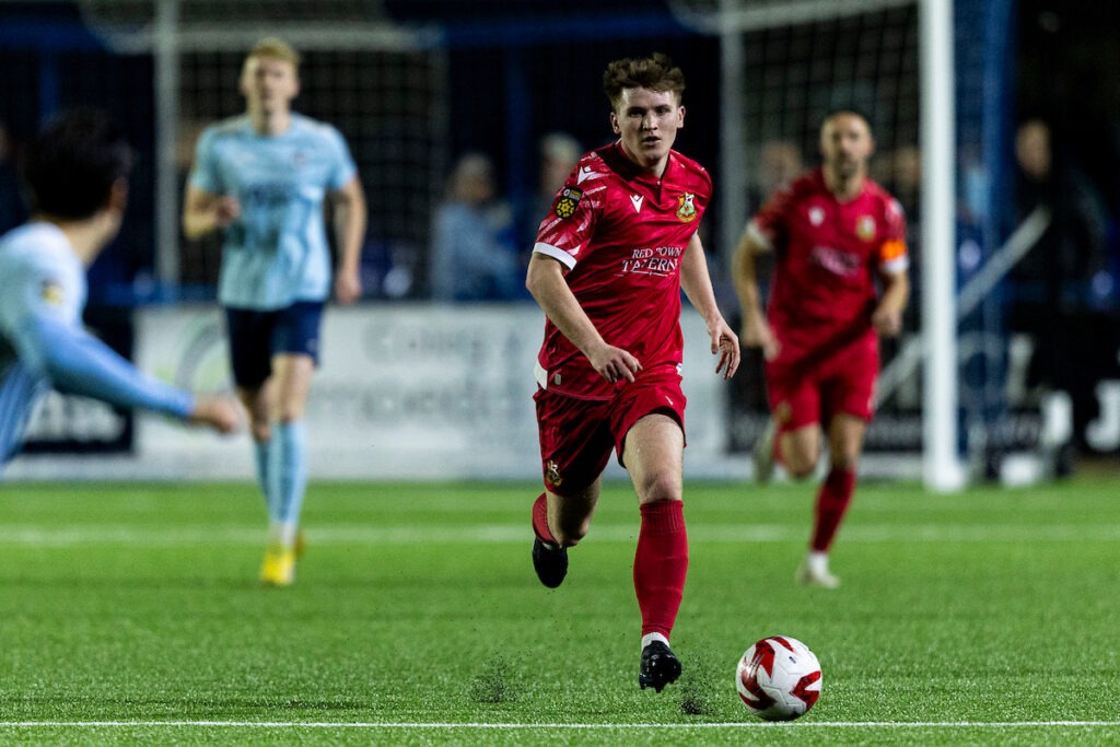 RHONDDA, WALES - 4TH APRIL 2025: Danny Williams of Llanelli Town in action. Cambrian United v Llanelli Town in the JD Cymru South at the M&P Group 3G on the 4th April 2025.