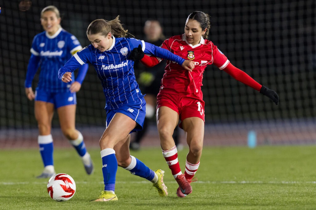 CARDIFF, WALES - 04 JANUARY 2026: Cardiff City Womens' Mikayla Cook and Wrexham Women's Mariam Mahmood during the 2025/2026 Genero Adran Leagues Premier league fixture between Cardiff City Women FC & Wrexham AFC Women at Cardiff Athletics Stadium, Cardiff, Wales