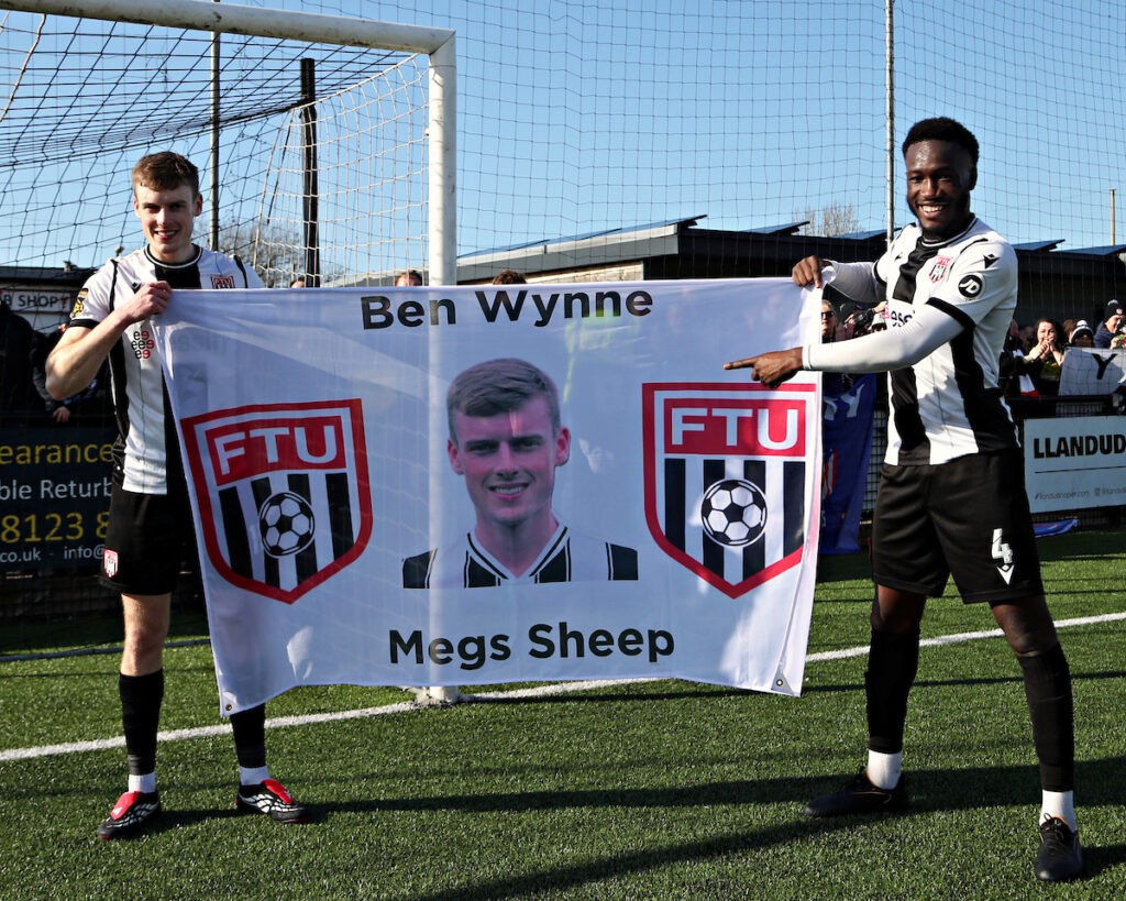 LLANDUDNO, WALES - 07 MARCH 2026: Ben Wynne of Flint Town United and Sidi Sanogo Fofana of Flint Town United celebrate after the JD Welsh Cup Semi-Final between Flint Town and Bangor City at Go Goodwins Stadium in Llandudno