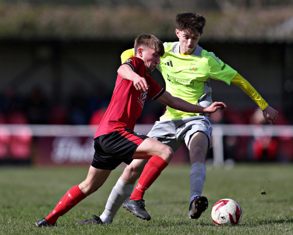 PENRHYNCOCH, CEREDIGION, WALES - 28th MARCH 2026 - Ryan Austin of Holywell Town FC and formerly of Wrexham battles with Guto Williams of Holywell Town FC during CPD Penrhyncoch vs Holywell Town in Round 28 of the JD Cymru North at Cae Baker, Penrhyncoch