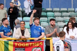 Haverfordwest County's fans during the JD Cymru Premier 25/26 European Play-Off match between Barry Town United and Haverfordwest County AFC at Jenner Park Stadium in Barry on the 26th April 2026