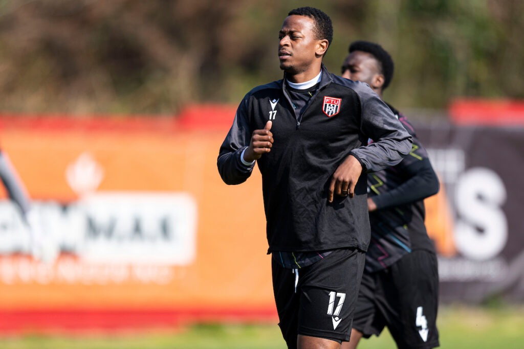 BRITON FERRY, WALES - 21 MARCH 2026: Alec Mudimu of Flint Town United warming up during the 2025/26 JD Cymru Premier match between Briton Ferry Llansawel & Flint Town United at the The Renewable Centre Stadium, Briton Ferry, Wales.