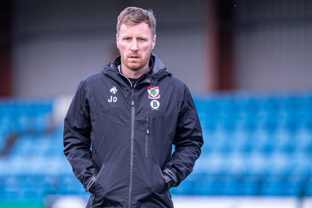 Jay Owen, manager of Cymru North club Newtown in a Colwyn Bay tracksuit