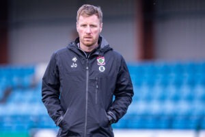 Jay Owen, manager of Cymru North club Newtown in a Colwyn Bay tracksuit