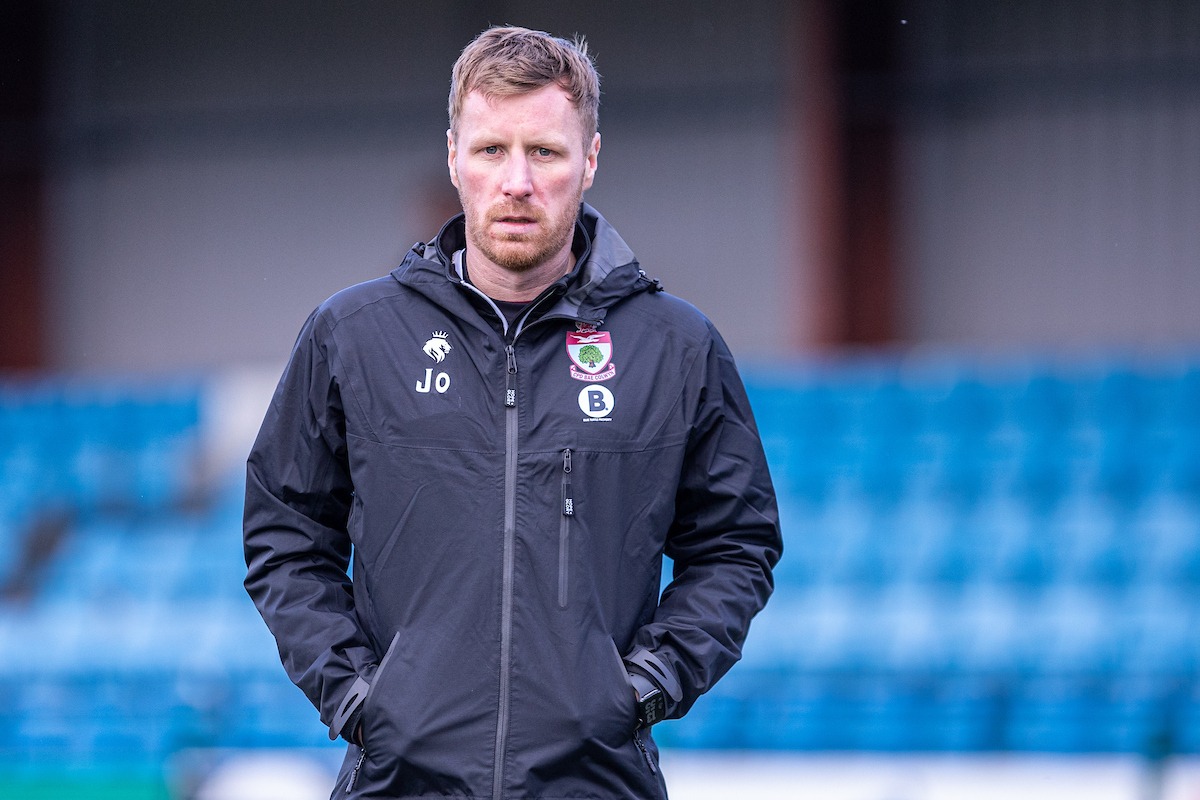 Jay Owen, manager of Cymru North club Newtown in a Colwyn Bay tracksuit