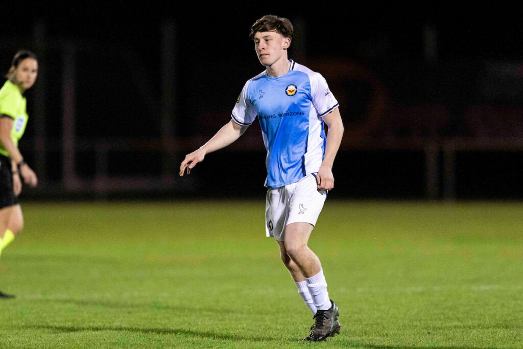 Harvey Sing in action for Newport City in a Cymru South game against Ammanford