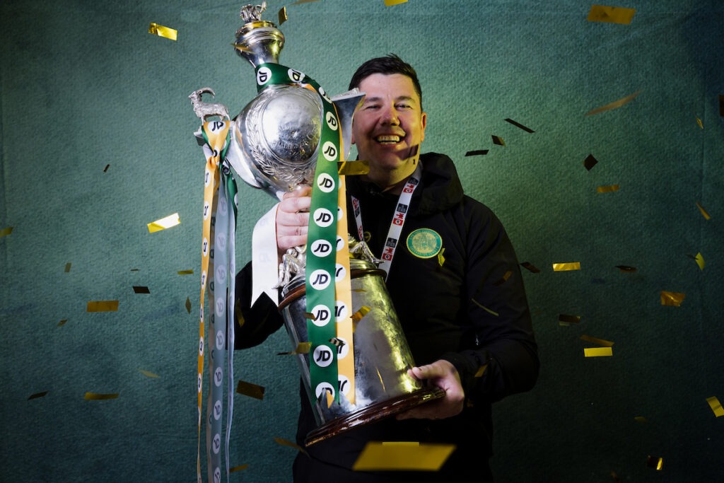 NEWPORT, WALES - 12 APRIL 2026: Caernarfon Town manager Richard Davies celebrates with the trophy after winning the 2025/26 JD FAW Welsh Cup Final fixture between Caernarfon Town F.C & Flint Town United F.C at Rodney Parade, Newport, Wales