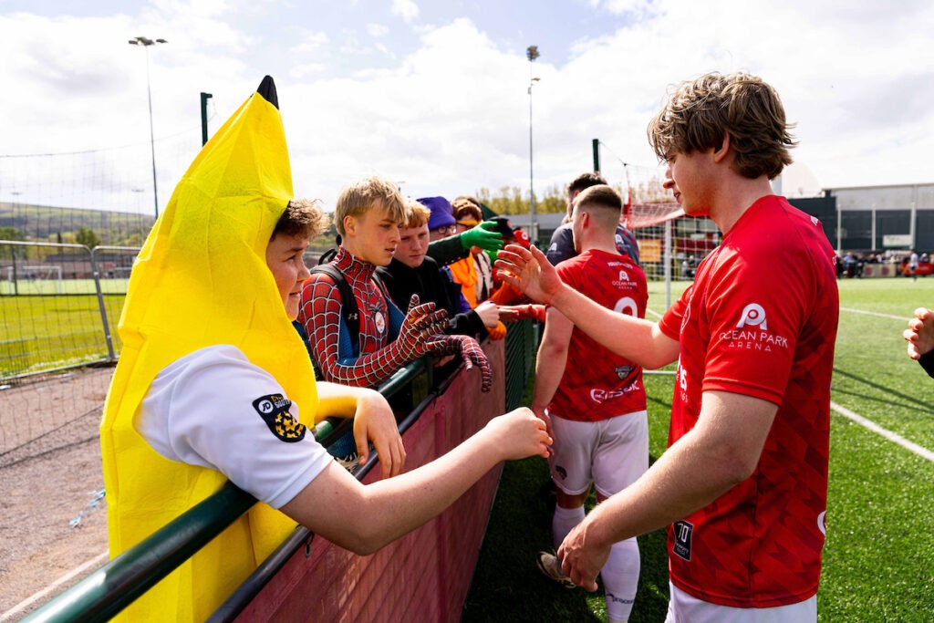 Caerau Ely players acknowledge their fans during the 2025/26 JD Cymru South fixture between Pontypridd United & Caerau Ely FC USW Sports Park, Pontypridd, Wales