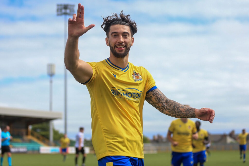 Ollie Hulbert celebrates scoring for Barry Town United against Bala Town