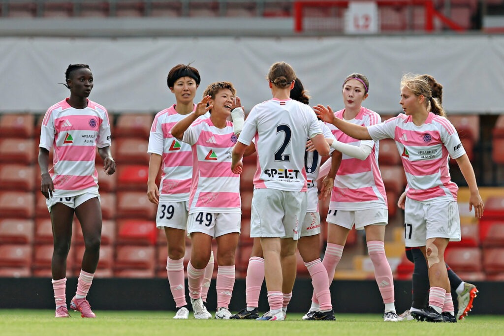 Minami Oi of Riga FC Women celebrates her goal during Riga Women FC vs Wrexham AFC Women in the Women's Champions League Qualification First Round Final at the Racecourse Ground, Wrexham