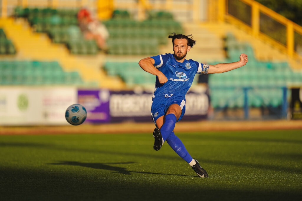Theo Gerry Richards (C) of Cardiff Airport scores from a free kick during the FAW Welsh Cup 2026/27 - Qualifying Round fixture Cardiff Airport vs Felinfach FC at Jenner Park, Barry, Wales