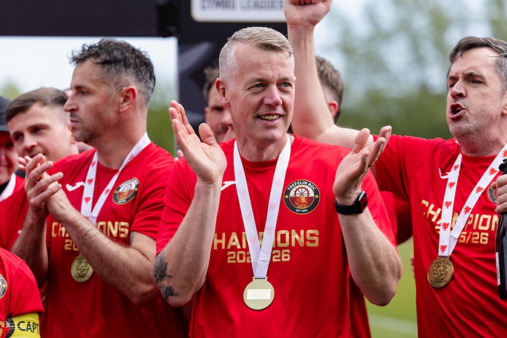 Trefelin's Manager Andy Hill as Trefelin celebrate lifting the cymru south trophy and promotion to the Cymru premier during the 2025/26 JD Cymru South fixture between Newport City FC & Trefelin BGC at Newport Stadium, Newport, Wales