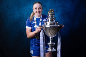 Cardiff City Women’s Helen Evans lifts the trophy as she celebrates their 2025/26 Bute Energy Welsh Cup Final victory over Swansea City Women at Rodney Parade in Newport.