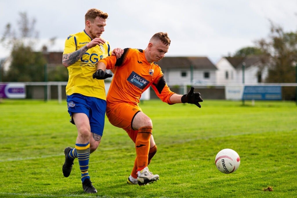 Port Talbot Town goalkeeper James Donnelly in action against Tom Walters of Llantwit Major.
Llantwit Major v Port Talbot Town in the JD Cymru South at Windmill Lane on the 30th October 2021
