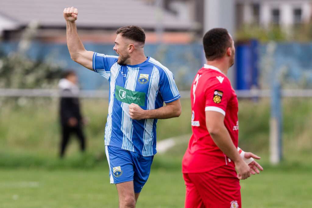 Port Talbot’s Jordan Edwards scores the opening goal of the game and celebrates during round 2 of the 2025/26 JD Welsh Cup  fixture between Port Talbot Town FC & Afan Lido FC, Victoria Road, Port Talbot, Wales