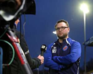 Michael Johnston, Manager of CPD Dinas Bangor 1876 is interviewed by Sgorio after CPD Dinas Bangor 1876 vs Trefelin BGC in Round 4 of the JD Welsh Cup at Bangor City Stadium, Bangor